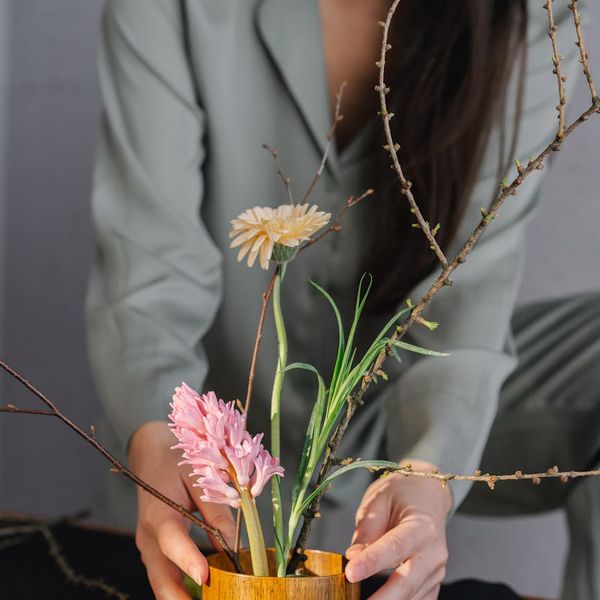 Smiling person feeling energized and serene in a brightly lit room.